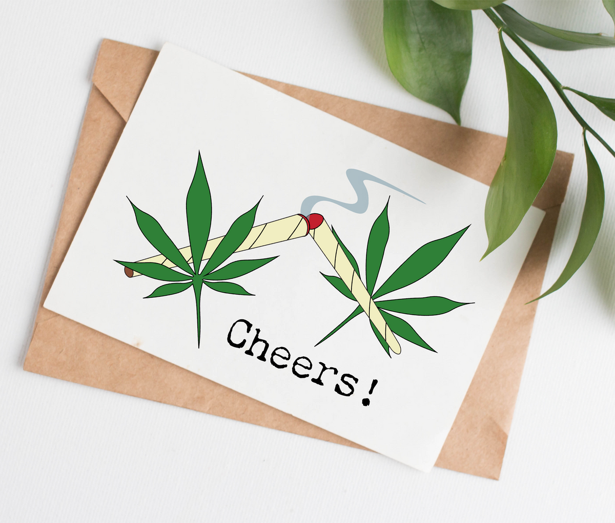 Card shows two joints coming together with a wisp of smoke rising from the middle, along with two big marijuana leaves to the sides. The captions says, "Cheers!"