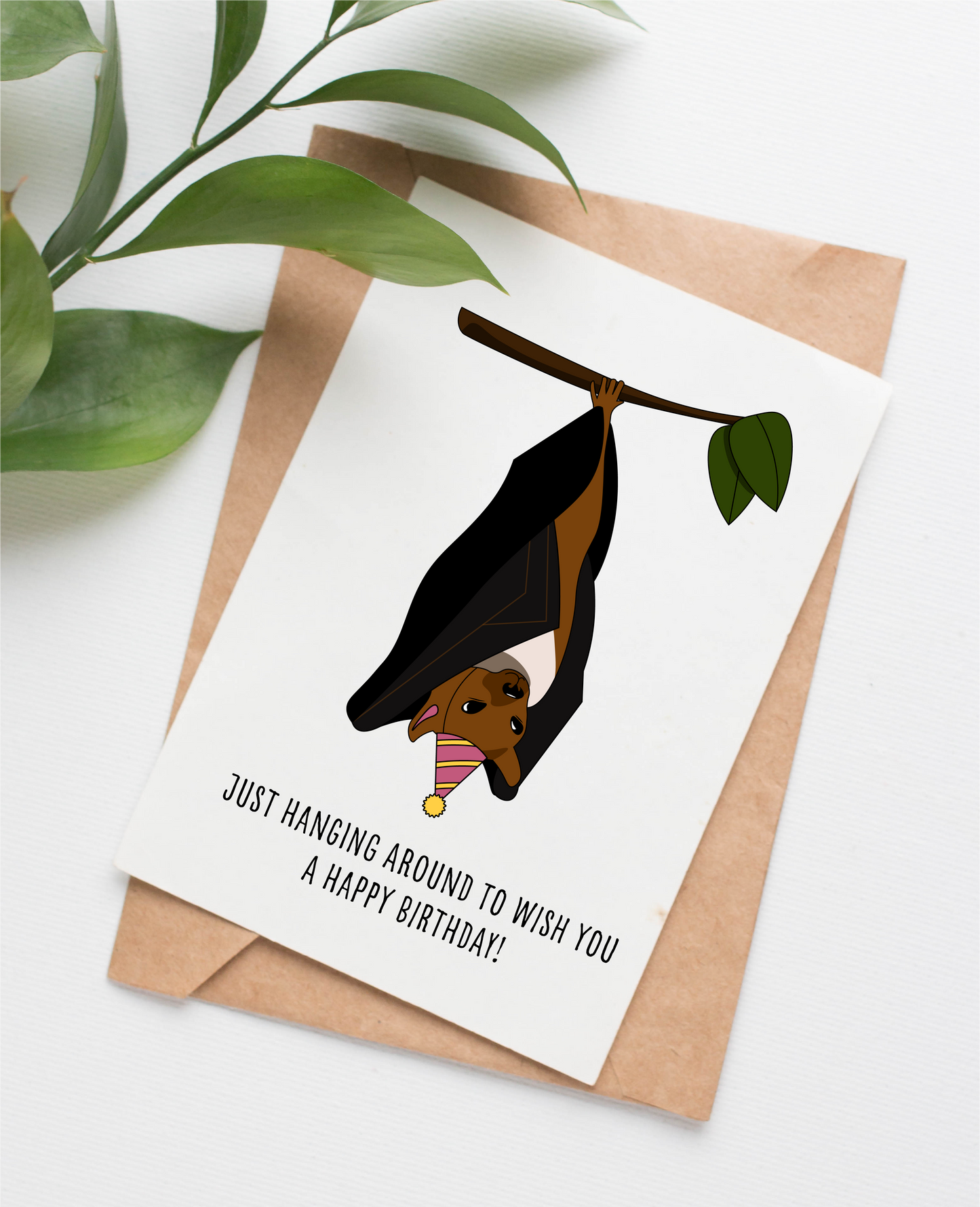 Canadian made birthday card with an illustrated bat and a caption that says "Just hanging around to wish you a happy birthday!"