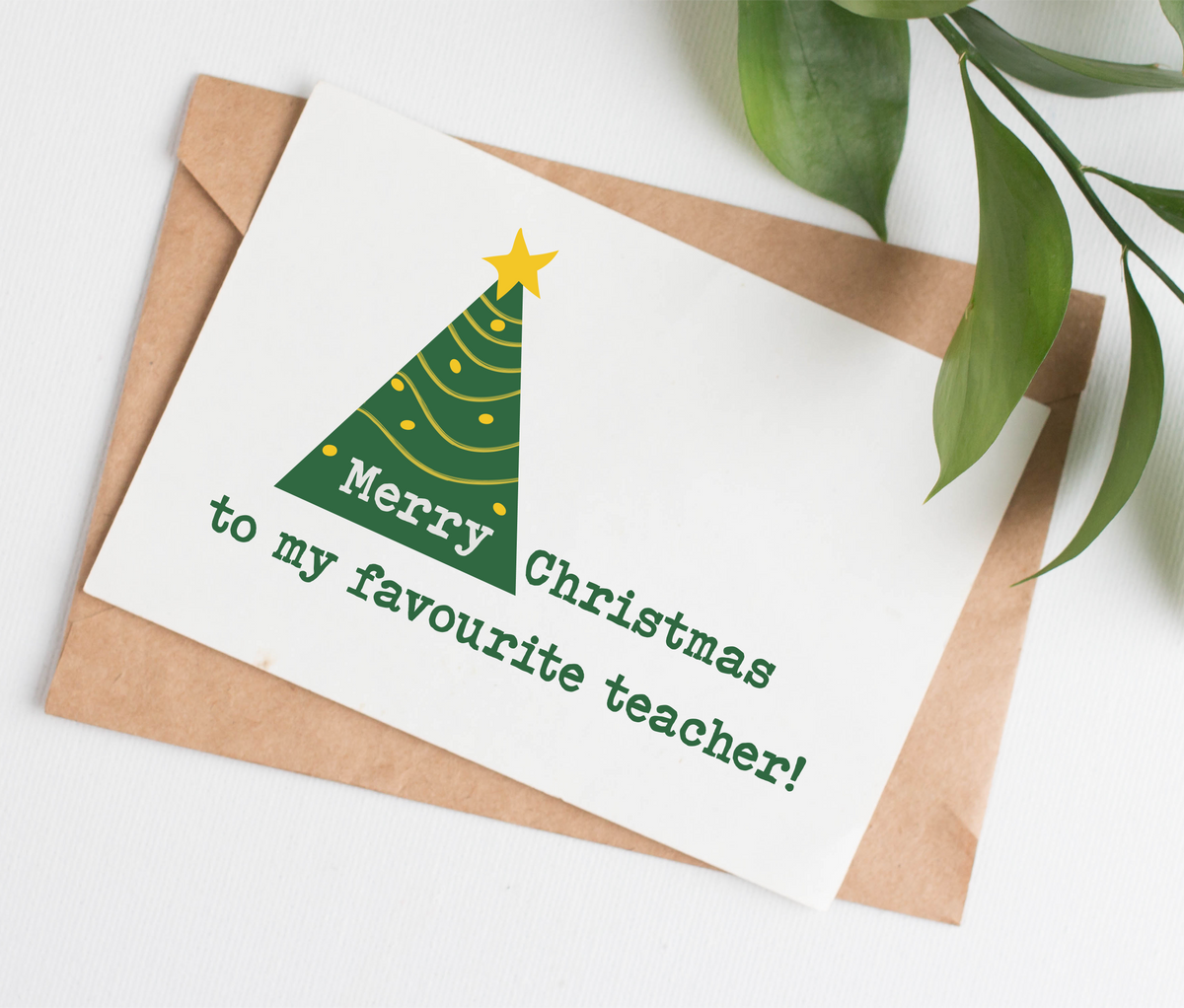 Card has an illustrated green and gold Christmas tree and the caption "Merry Christmas to my favourite teacher!"