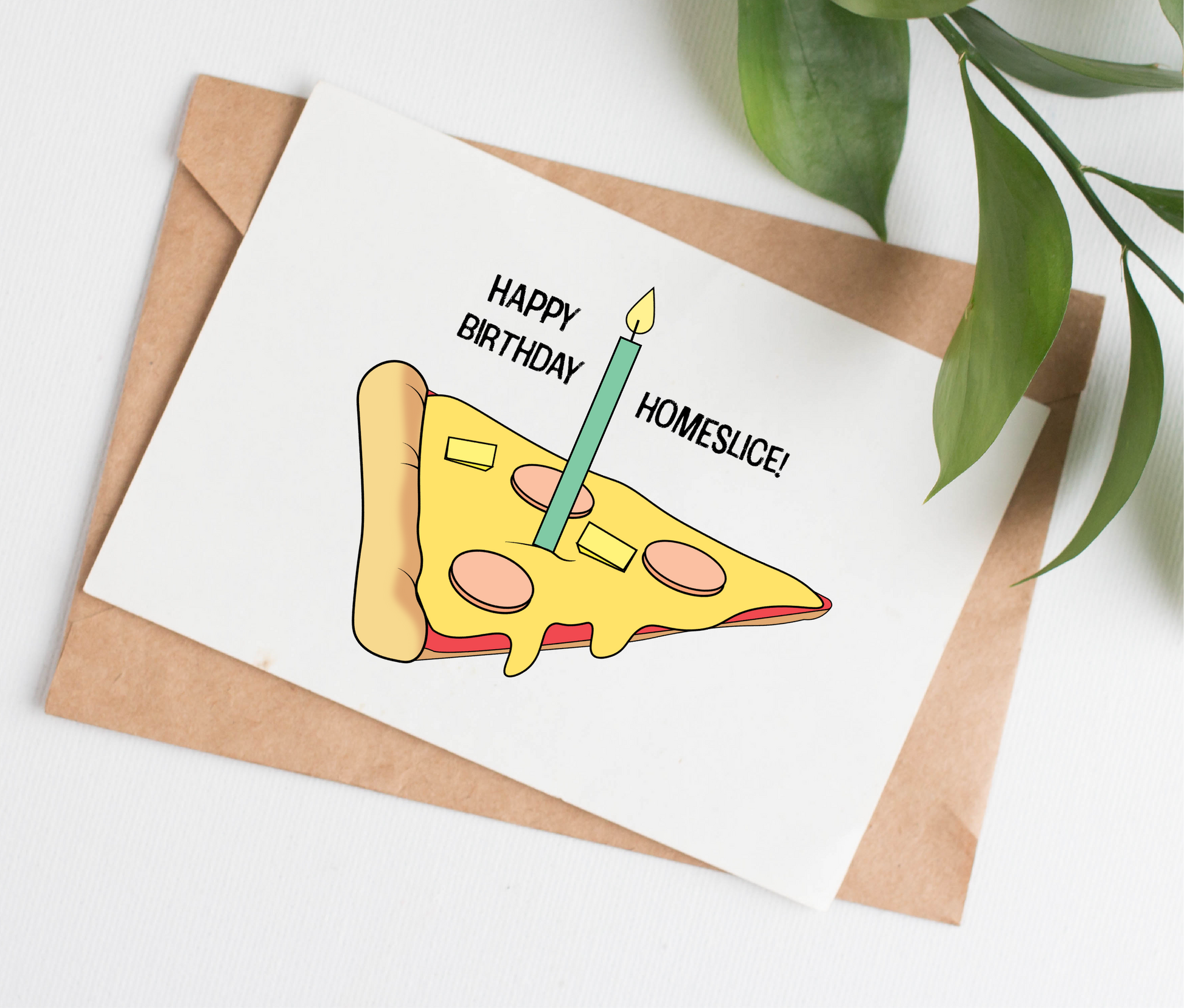 This handmade birthday card is made in Canada. It shows a slice of Hawaiian pizza with ham and pineapple, and a birthday candle on top. The text says "happy birthday homeslice!"
